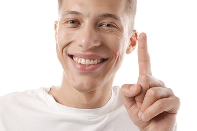 Photo of Man with contact lens on white background, closeup