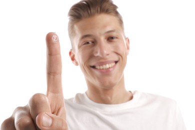 Photo of Man with contact lens on white background, selective focus
