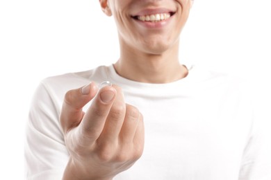 Photo of Man with contact lens on white background, closeup