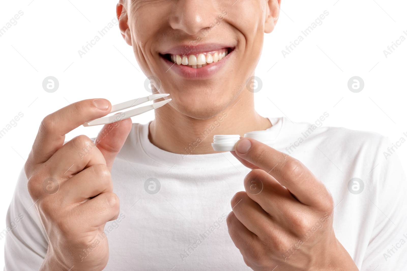 Photo of Man with contact lens and case on white background, closeup