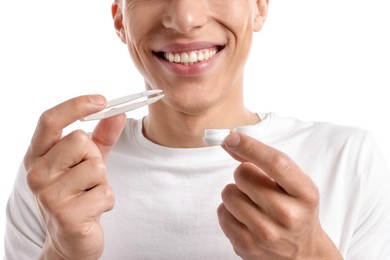 Photo of Man with contact lens and case on white background, closeup