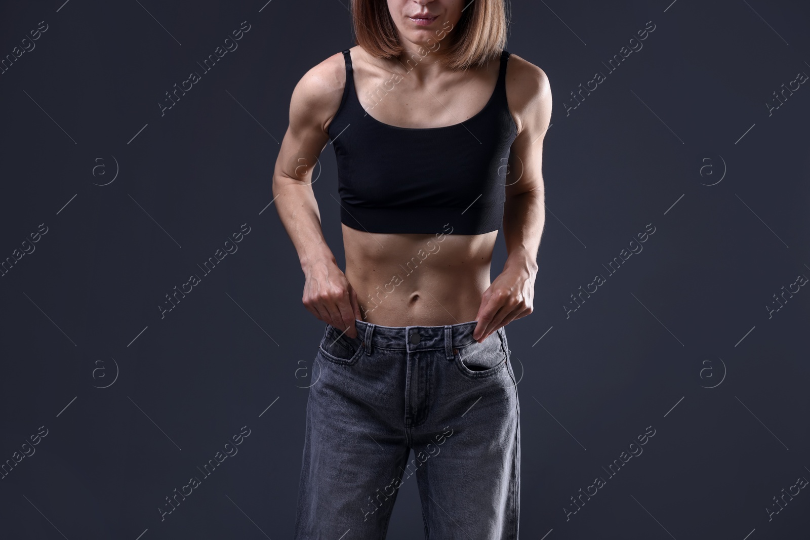 Woman suffering from anorexia on grey background, closeup Photo of Woman suffering from anorexia on grey background, closeup