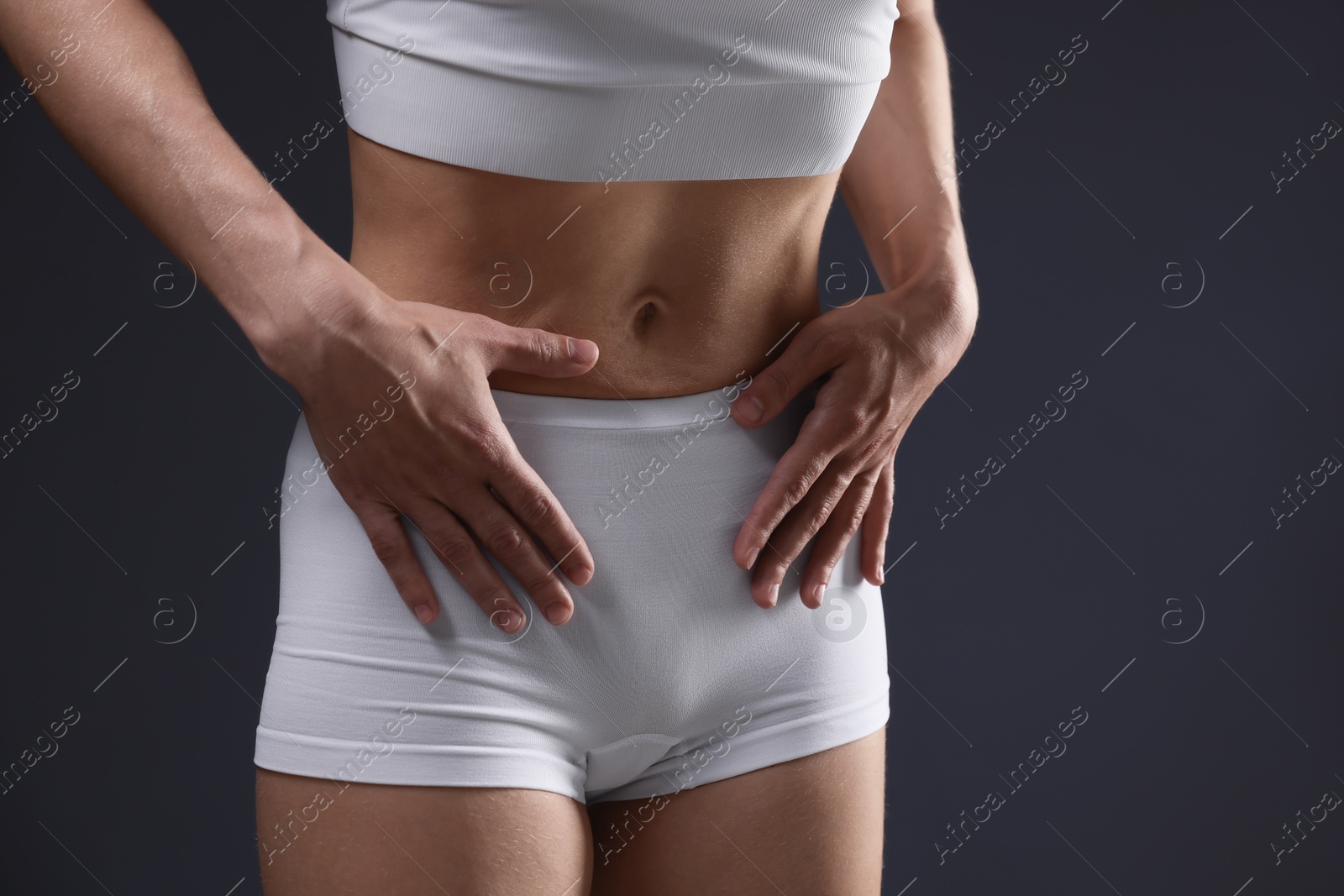 Woman suffering from anorexia on grey background, closeup. Space for text Photo of Woman suffering from anorexia on grey background, closeup. Space for text