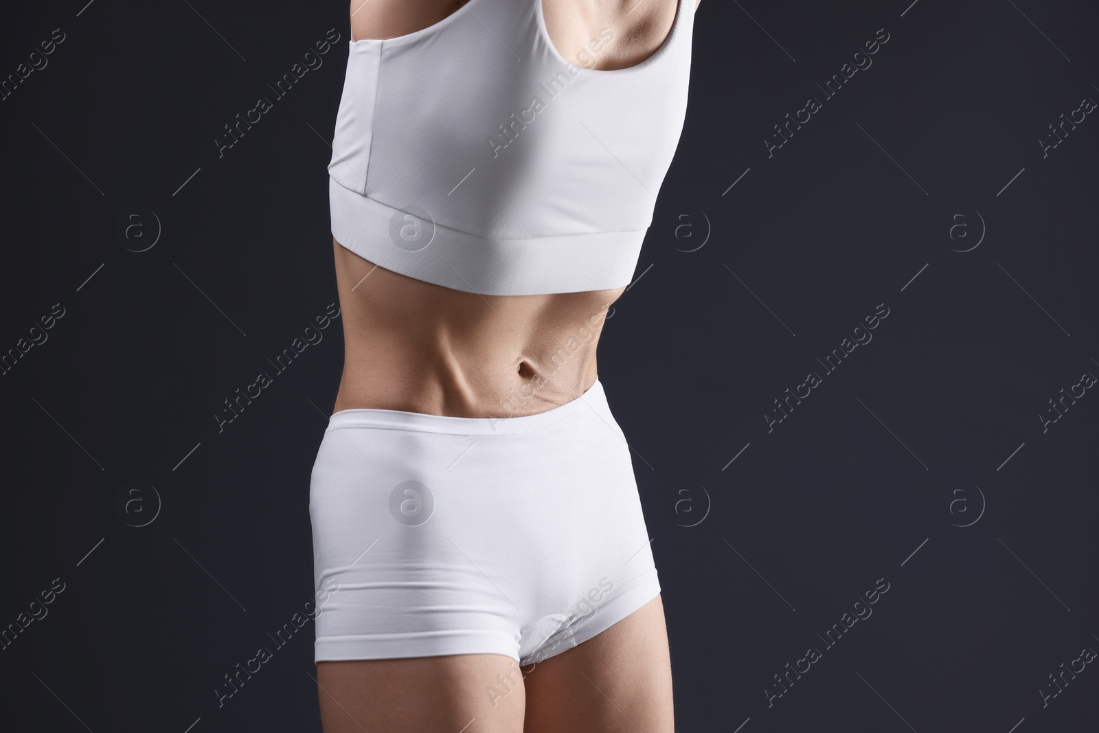 Woman suffering from anorexia on grey background, closeup Photo of Woman suffering from anorexia on grey background, closeup