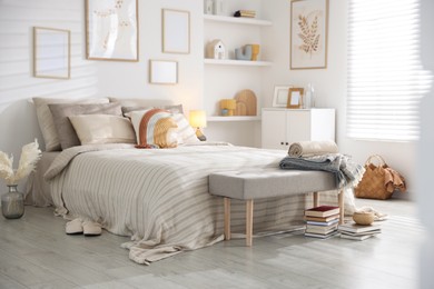 Photo of Comfortable bed with soft linens in room. Home textile