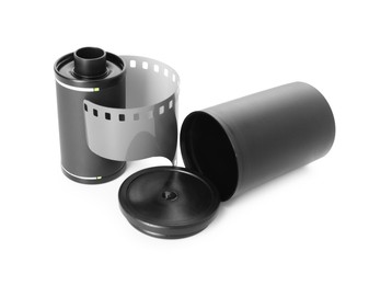 Photo of Roll of photographic film and canister isolated on white