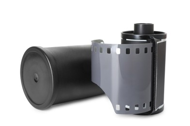Photo of Roll of photographic film and canister isolated on white