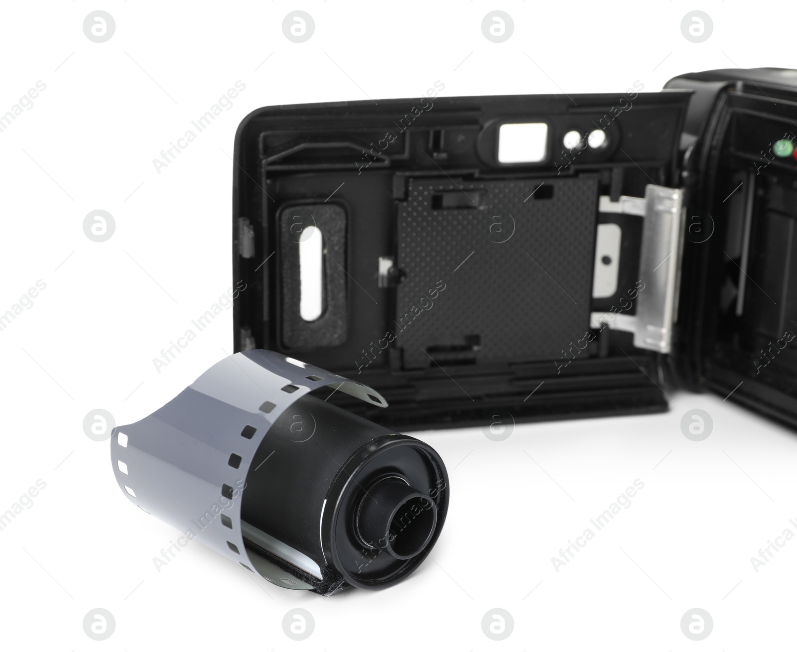 Roll of photographic film and photo camera isolated on white Photo of Roll of photographic film and photo camera isolated on white