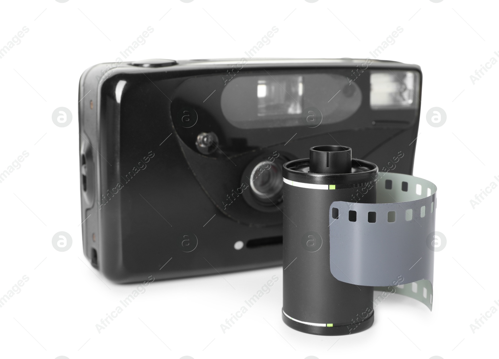 Roll of photographic film and photo camera isolated on white Photo of Roll of photographic film and photo camera isolated on white
