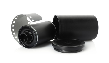 Photo of Roll of photographic film and canister isolated on white