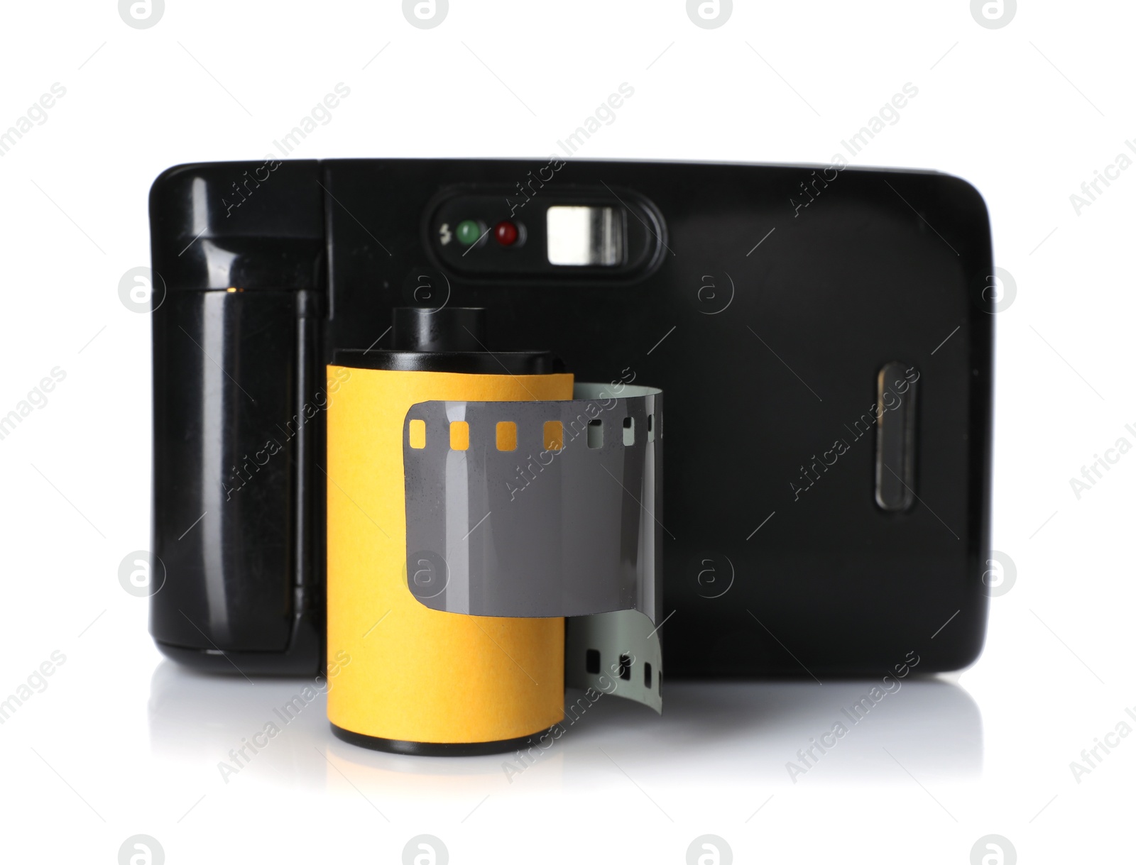 Roll of photographic film and photo camera isolated on white Photo of Roll of photographic film and photo camera isolated on white