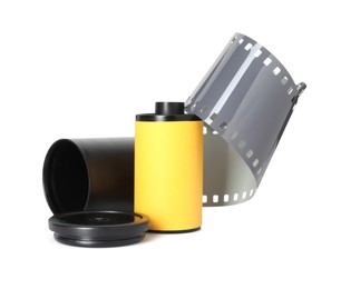 Photo of Roll of photographic film and canister isolated on white