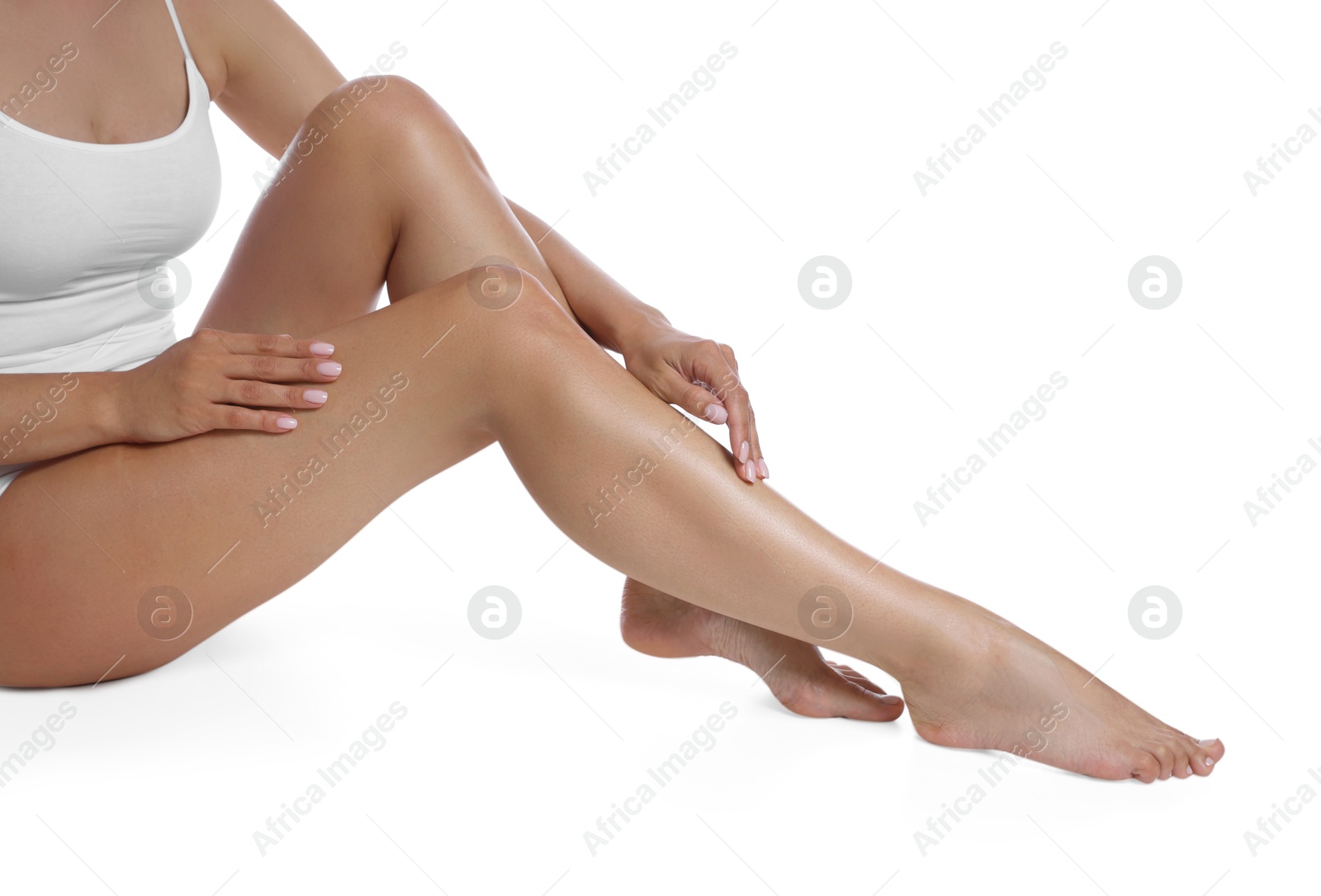 Woman with beautiful smooth legs after epilation on white background, closeup Photo of Woman with beautiful smooth legs after epilation on white background, closeup