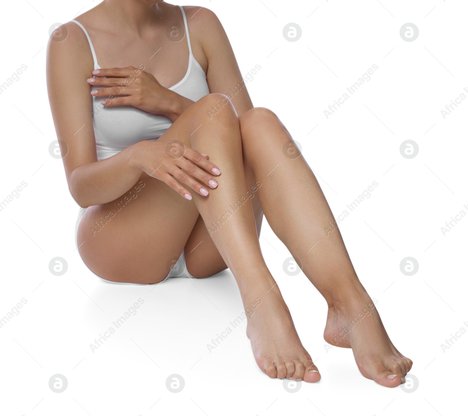 Woman with beautiful smooth legs after epilation on white background, closeup Photo of Woman with beautiful smooth legs after epilation on white background, closeup