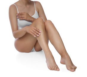 Photo of Woman with beautiful smooth legs after epilation on white background, closeup