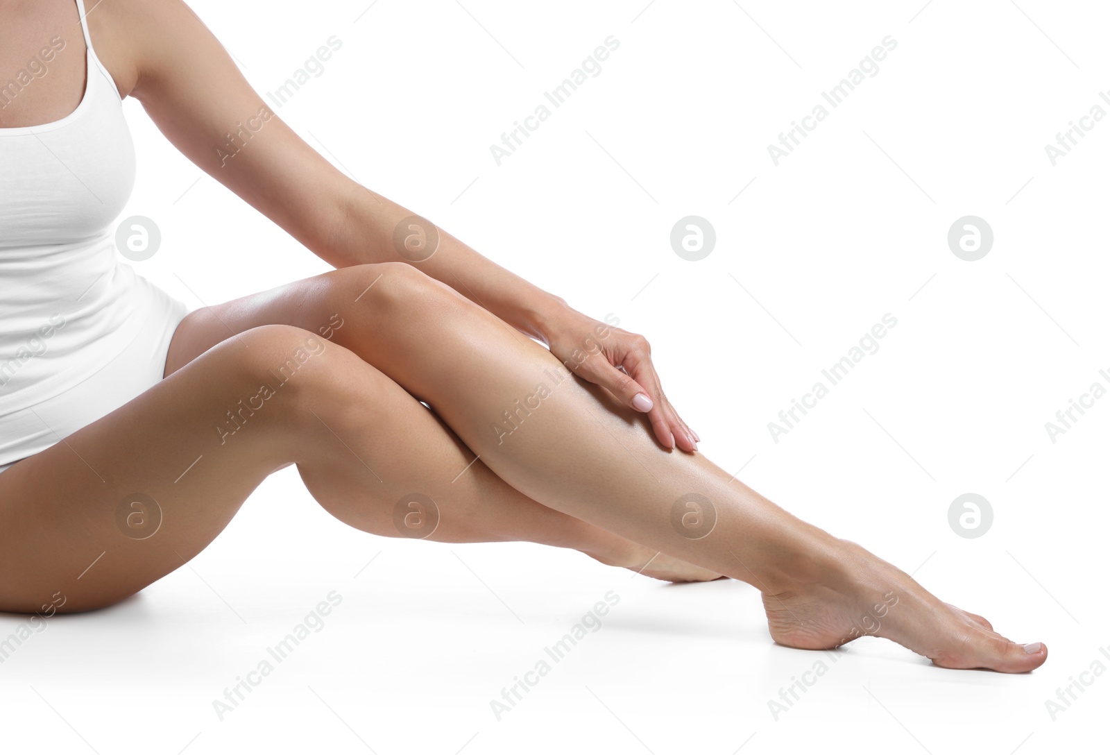 Woman with beautiful smooth legs after epilation on white background, closeup Photo of Woman with beautiful smooth legs after epilation on white background, closeup