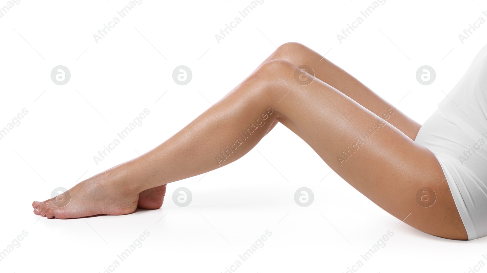 Woman with beautiful smooth legs after epilation on white background, closeup Photo of Woman with beautiful smooth legs after epilation on white background, closeup