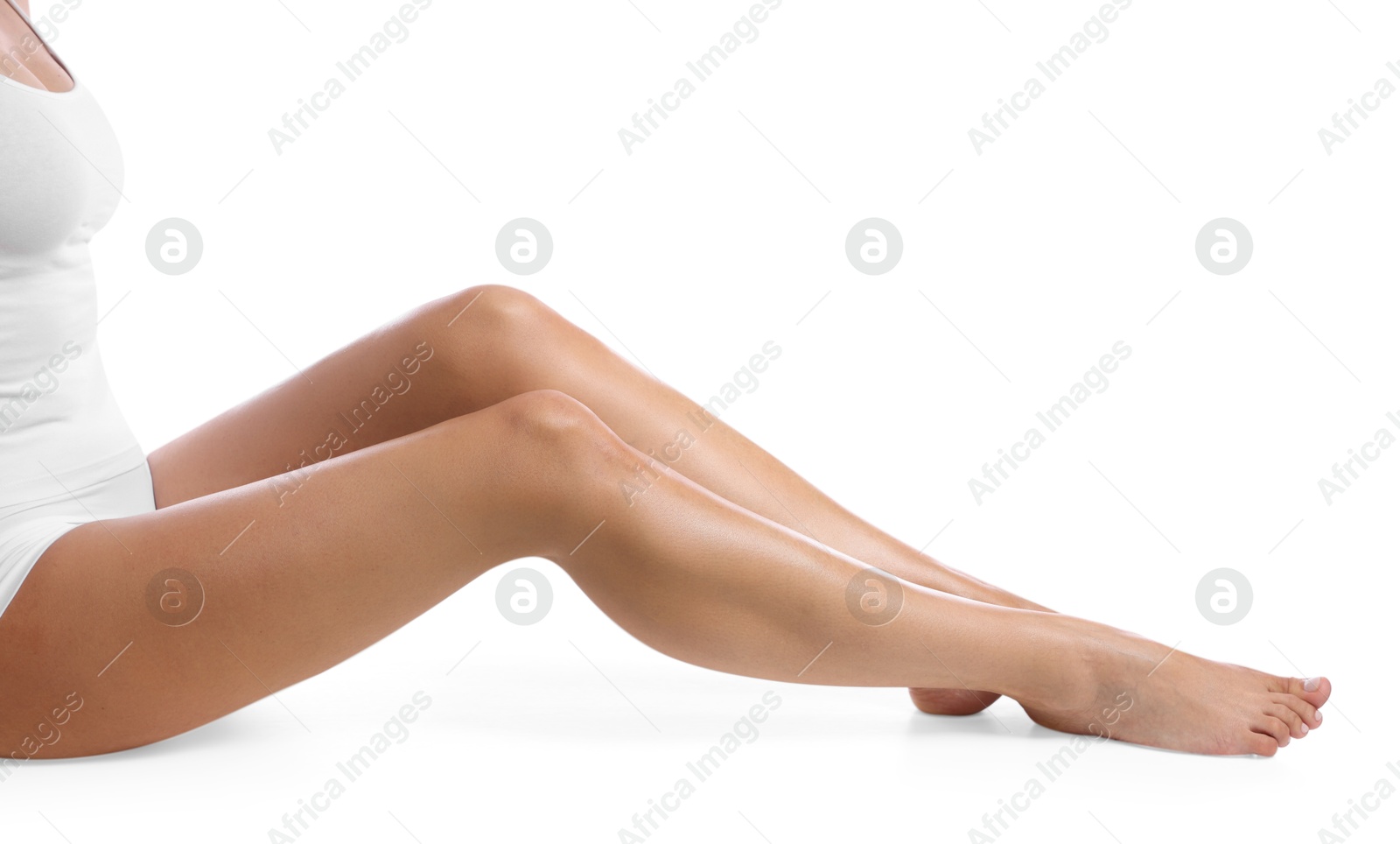 Woman with beautiful smooth legs after epilation on white background, closeup Photo of Woman with beautiful smooth legs after epilation on white background, closeup