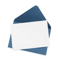 Photo of Blank invitation card and envelope isolated on white, top view. Space for design