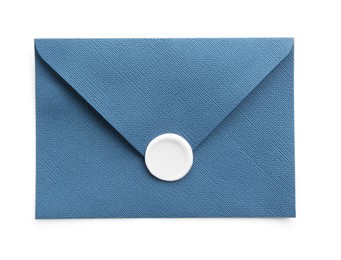 Photo of Beautiful invitation envelope with wax seal isolated on white, top view