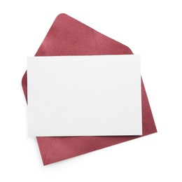 Photo of Blank invitation card and envelope isolated on white, top view. Space for design