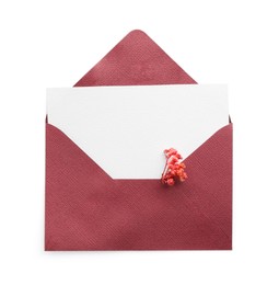 Photo of Blank invitation card and envelope with flower isolated on white, top view. Space for design