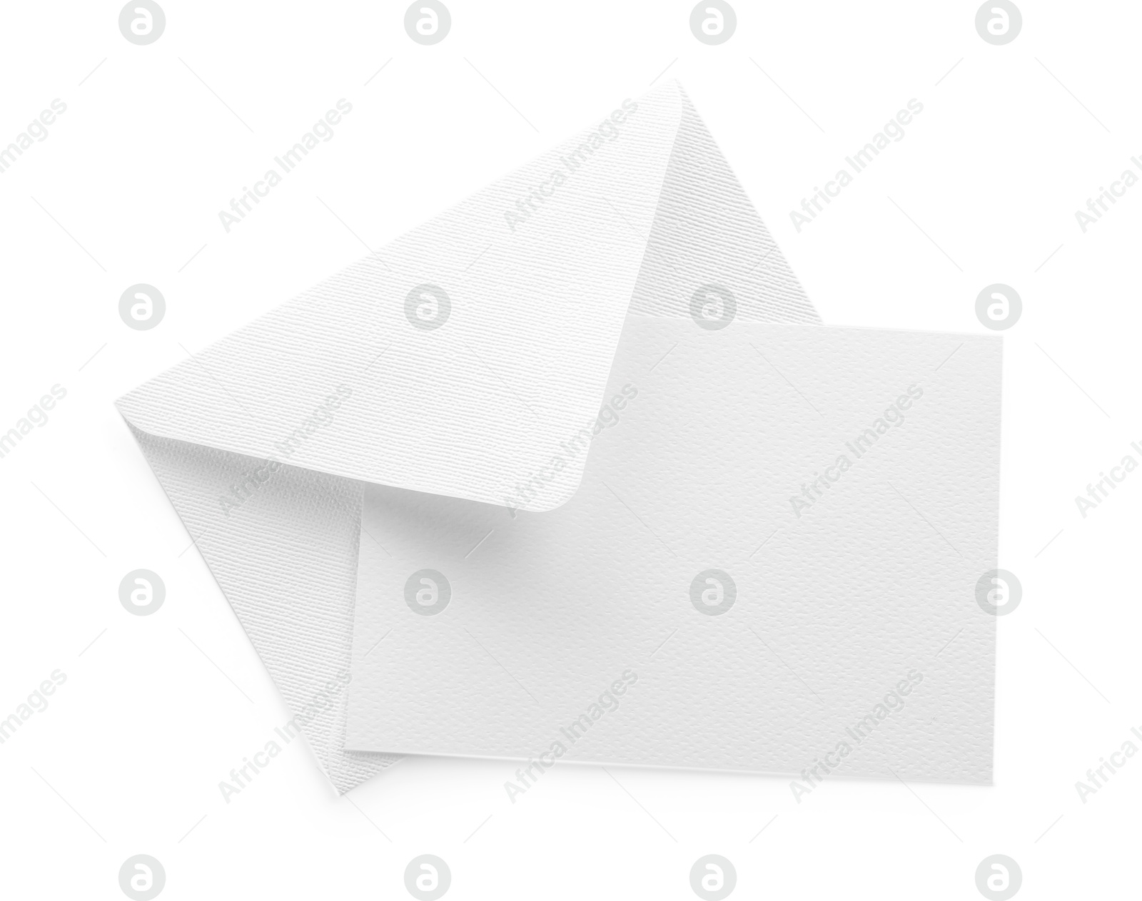 Photo of Blank invitation card and envelope isolated on white, top view. Space for design