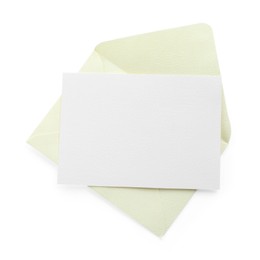 Photo of Blank invitation card and envelope isolated on white, top view. Space for design
