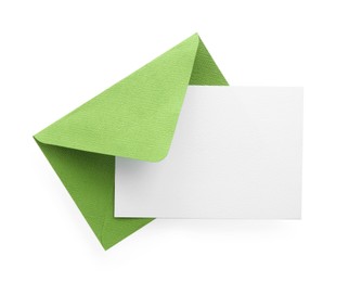 Photo of Blank invitation card and envelope isolated on white, top view. Space for design