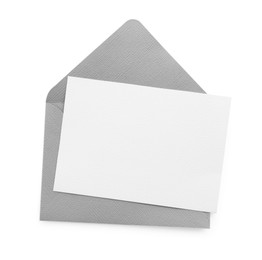 Photo of Blank invitation card and envelope isolated on white, top view. Space for design