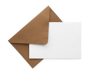 Photo of Blank invitation card and envelope isolated on white, top view. Space for design