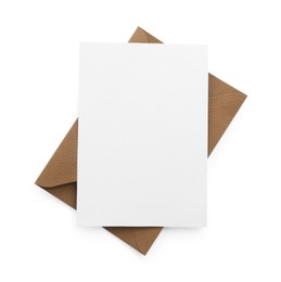 Photo of Blank invitation card and envelope isolated on white, top view. Space for design