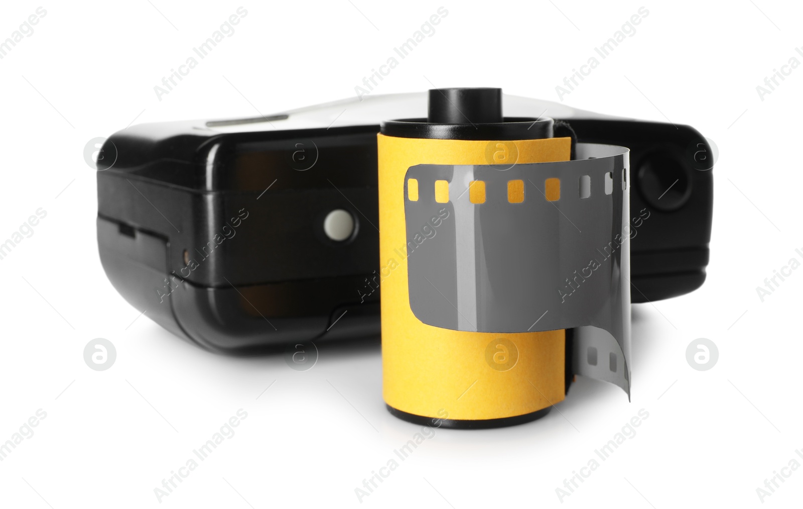 Roll of photographic film and photo camera isolated on white Photo of Roll of photographic film and photo camera isolated on white