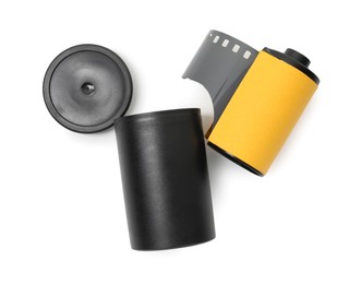 Photo of Roll of photographic film and canister isolated on white, top view