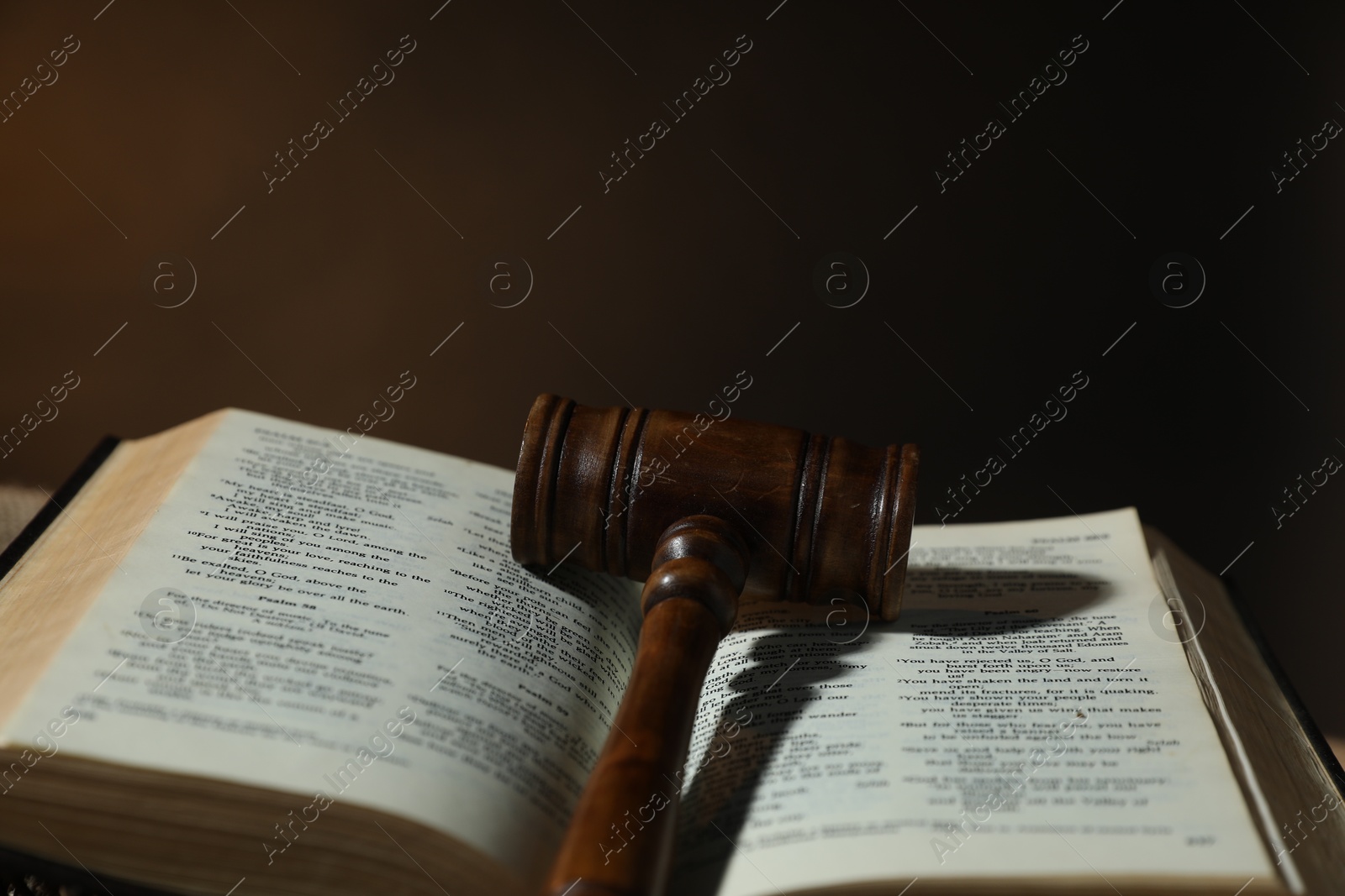 Judge's gavel and Bible on dark background, closeup Photo of Judge's gavel and Bible on dark background, closeup
