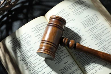 Photo of Judge's gavel and Bible on table, above view