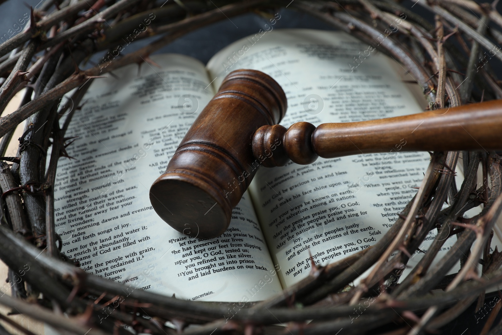 Judge's gavel, crown of thorns and Bible on table, closeup Photo of Judge's gavel, crown of thorns and Bible on table, closeup