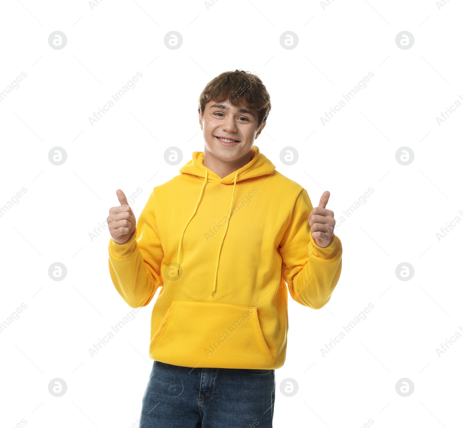 Teenage boy showing thumbs ups on white background Photo of Teenage boy showing thumbs ups on white background