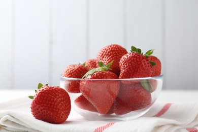 Photo of Fresh ripe strawberries on white table, closeup