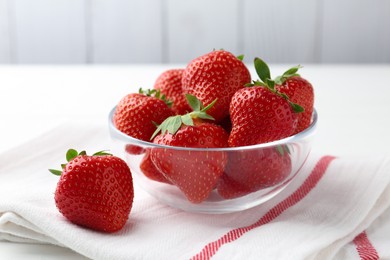 Photo of Fresh ripe strawberries on white table, closeup