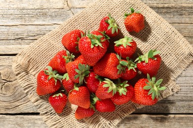 Photo of Fresh ripe strawberries on wooden table, top view