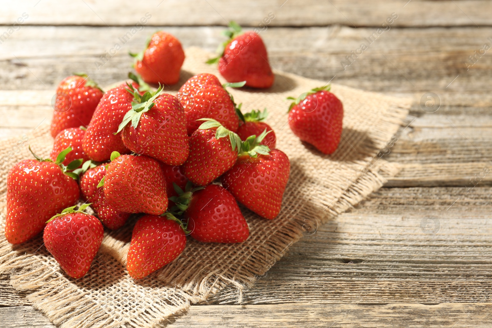 Fresh ripe strawberries on wooden table, closeup Photo of Fresh ripe strawberries on wooden table, closeup