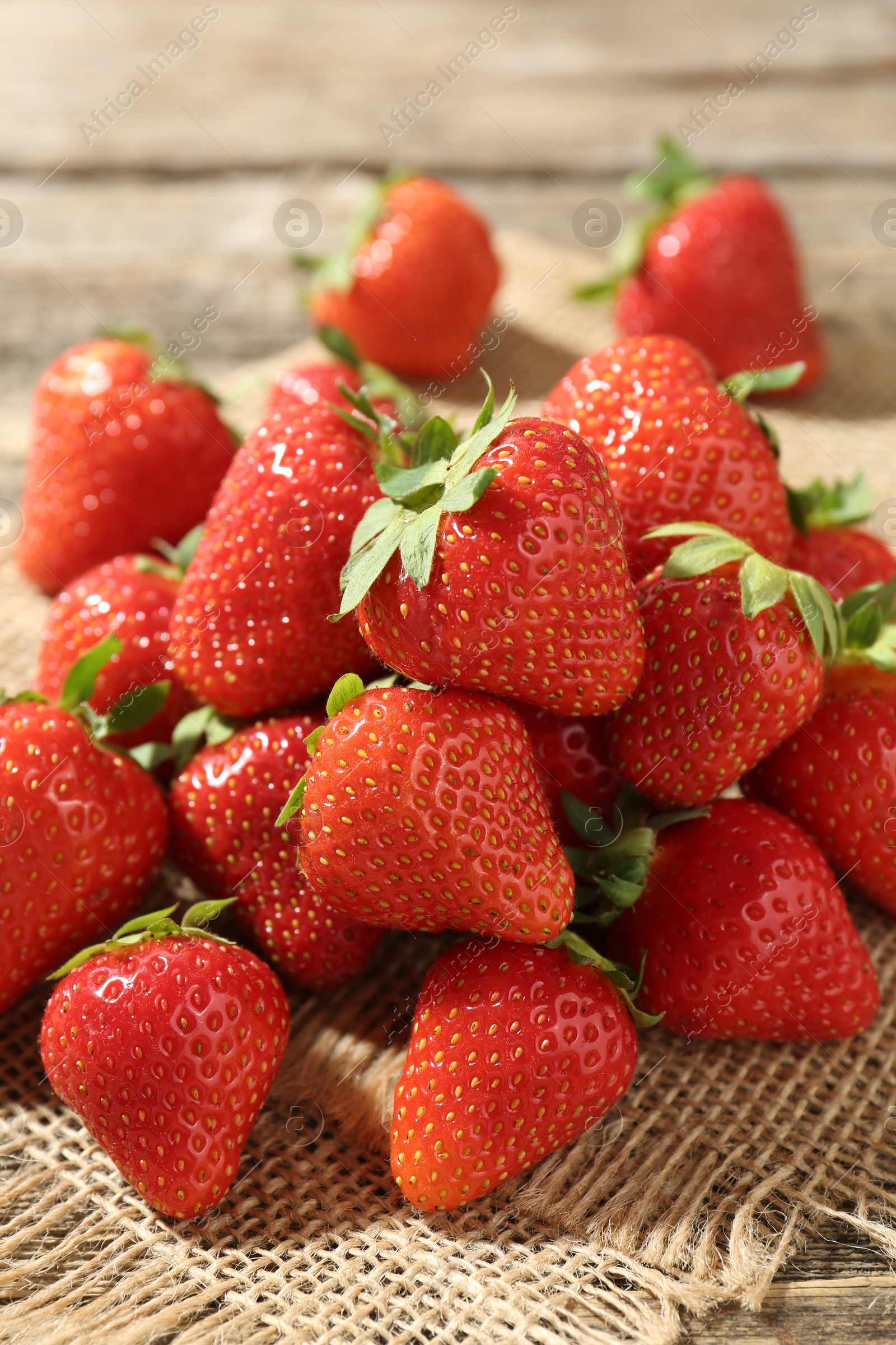 Fresh ripe strawberries on wooden table, closeup Photo of Fresh ripe strawberries on wooden table, closeup