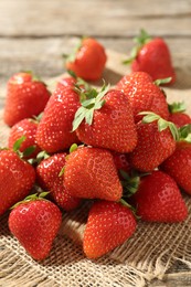 Photo of Fresh ripe strawberries on wooden table, closeup
