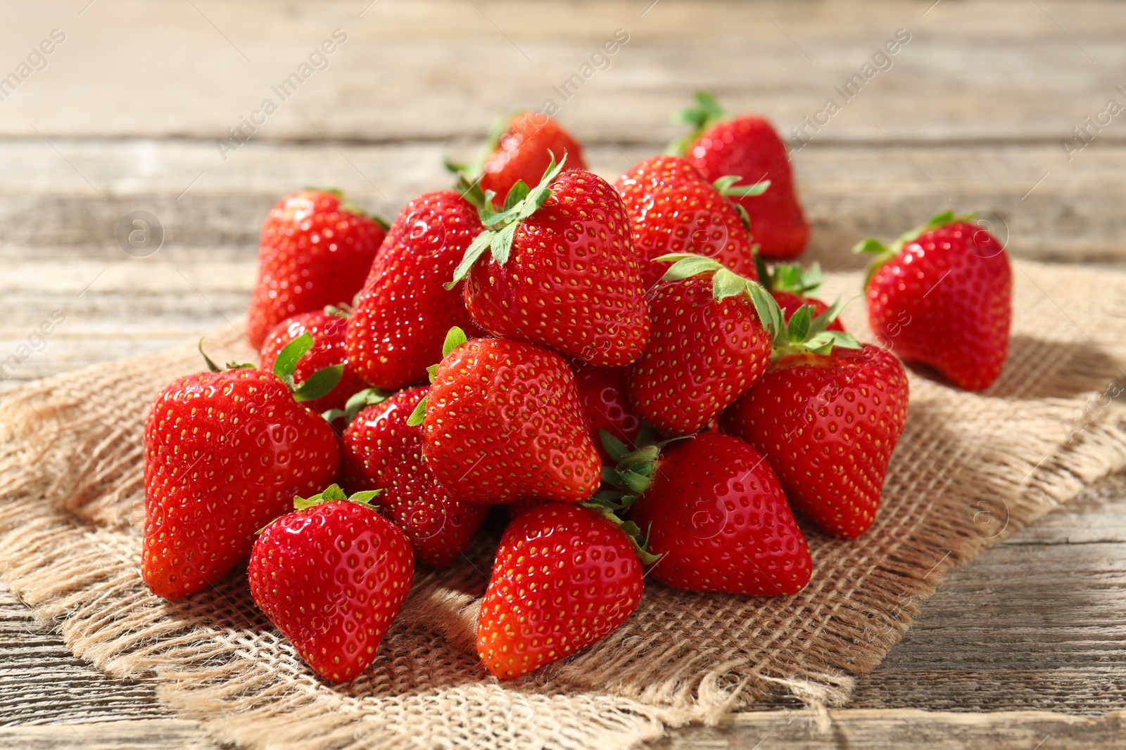 Fresh ripe strawberries on wooden table, closeup Photo of Fresh ripe strawberries on wooden table, closeup