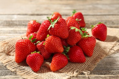 Photo of Fresh ripe strawberries on wooden table, closeup