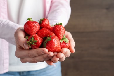 Photo of Woman with delicious ripe strawberries indoors, closeup. Space for text