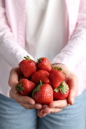 Photo of Woman with many delicious ripe strawberries, closeup