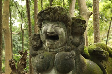 Photo of Bali, Indonesia - June 2, 2025: Ancient fertility goddess statue in Ubud Monkey Forest