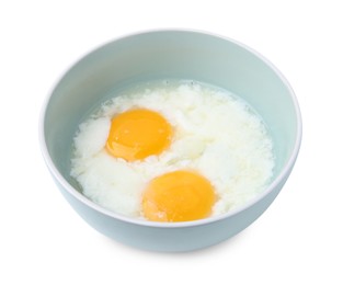 Photo of Half-boiled eggs in bowl isolated on white. Traditional asian breakfast